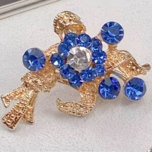 Elegant Gold and Blue Crystal Brooch